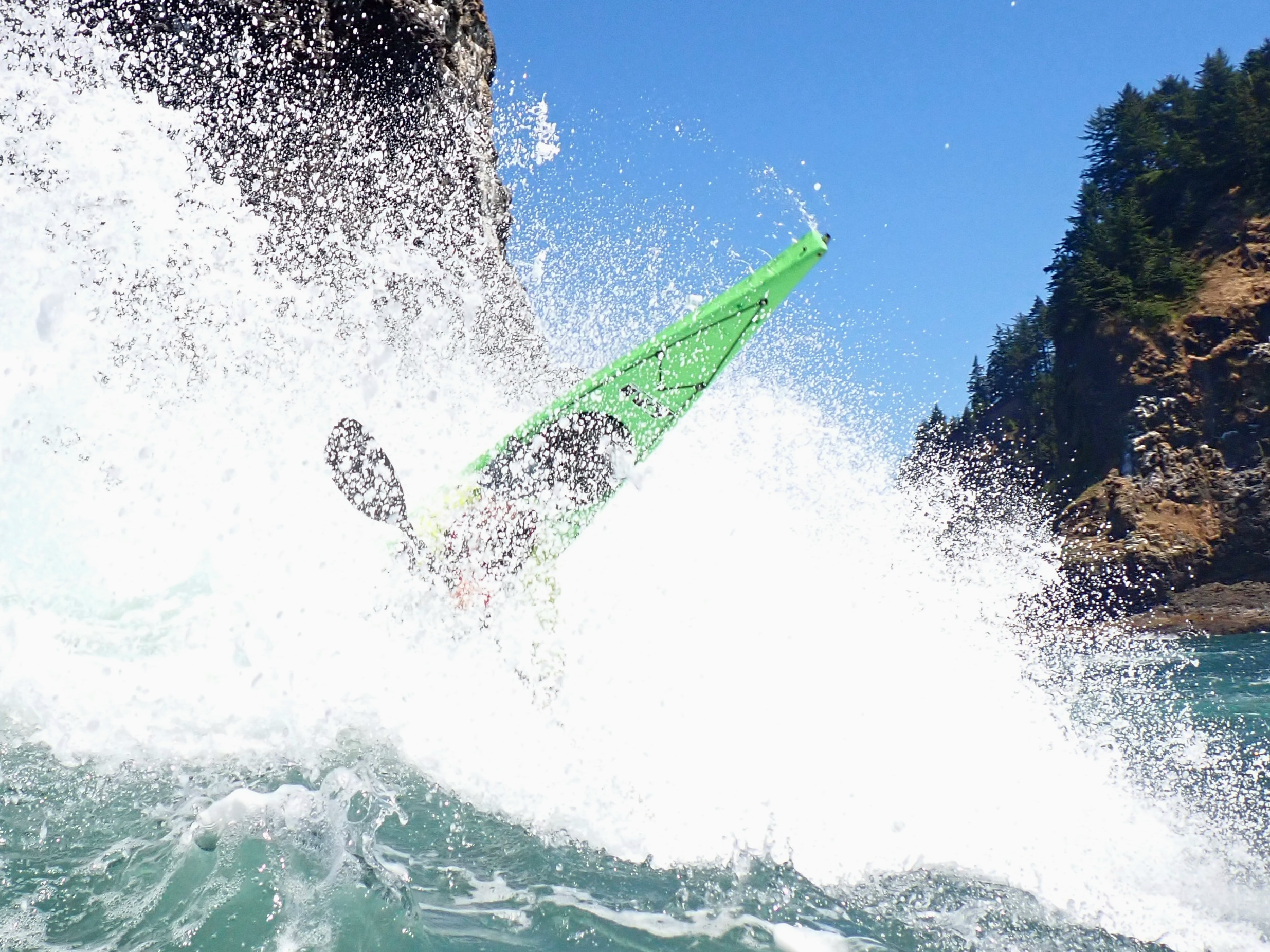 Kyle Banerjee kayaking off Cascade Head